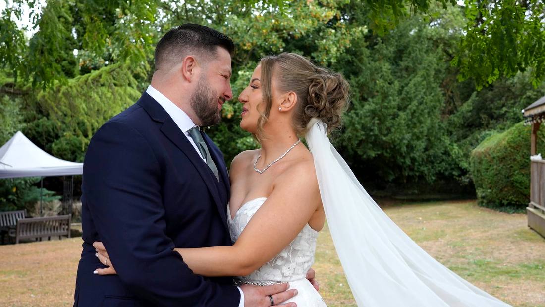 A couple embracing in a garden